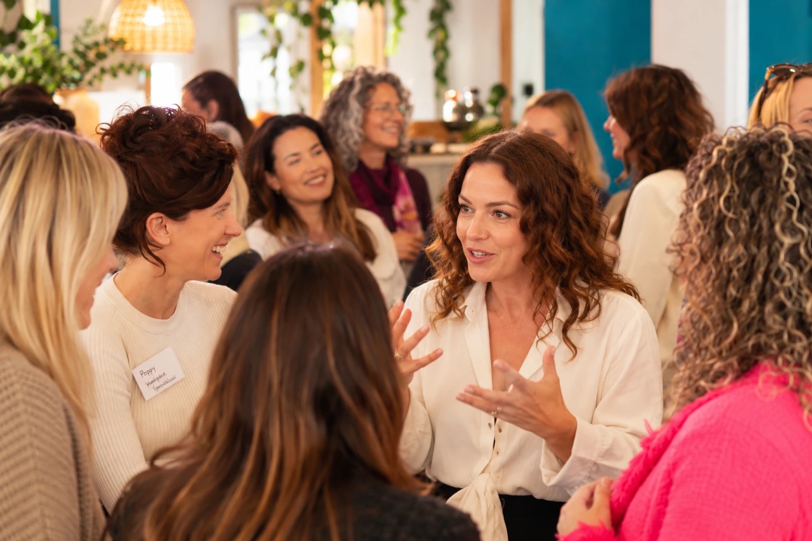 Women in conversation at a Women's Money Society gathering